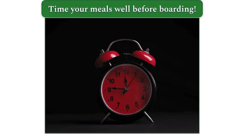 a red clock timer on a table