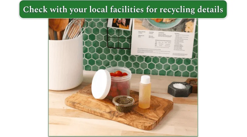 Image of the plastic condiment pots used by Home Chef displayed on a board in a kitchen