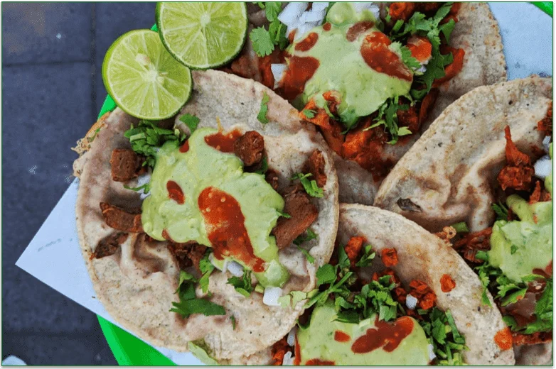 Whole grain tacos filled with vegetables and sauces