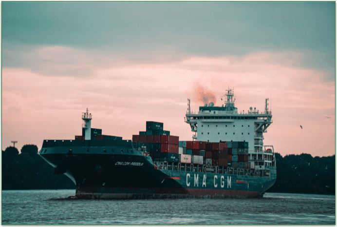 A freight ship on the ocean carrying freight.