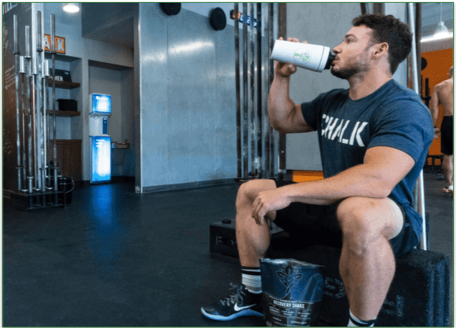  A person enjoying a protein shake after an intense workout