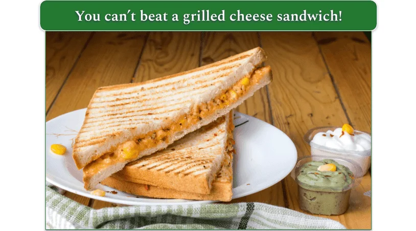 Grilled cheese sandwich on a plate served with guacamole and sour cream