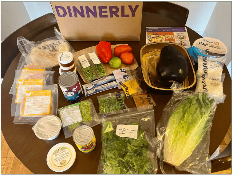 Dinnerly box with unpacked ingredients on a table