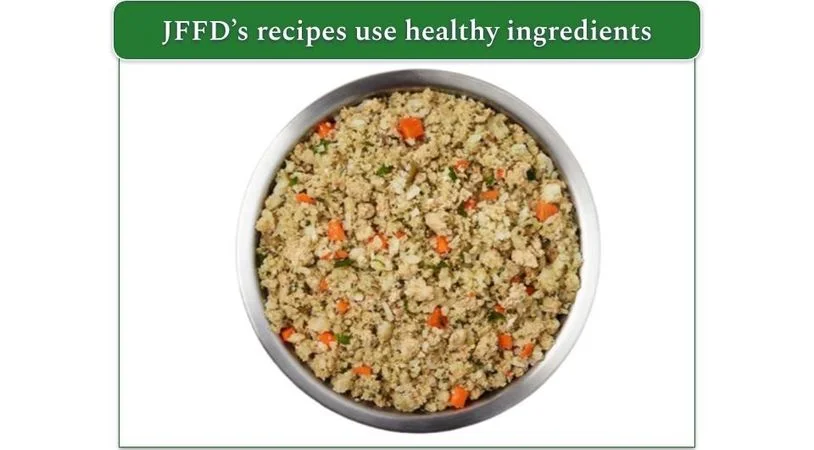 Image of a bowl of JFFD's Chicken & White Rice with carrots and spinach