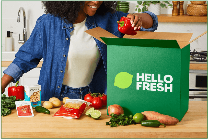 Woman unpacking a hellofresh box