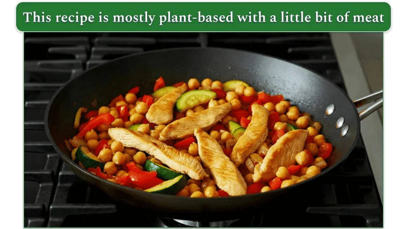 Some chickpea stir-fry with bell pepper, zucchini, and chicken breast strips.