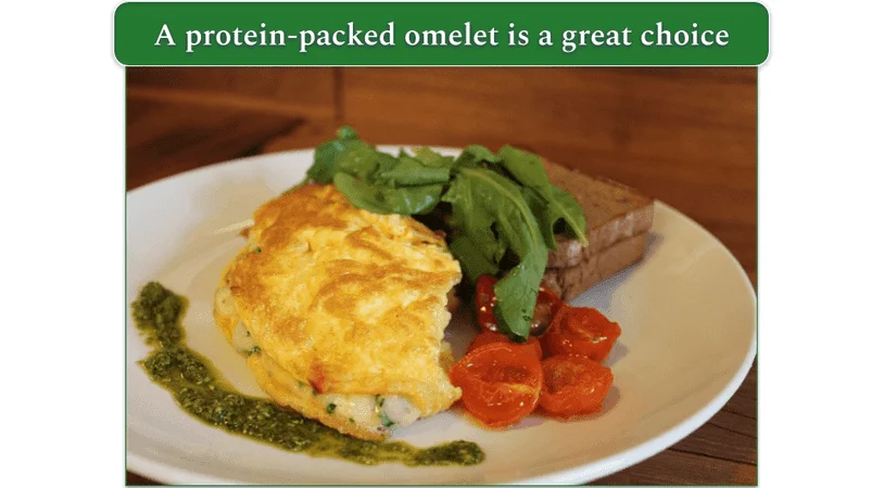 Omelet, toast, and veggies served on a plate