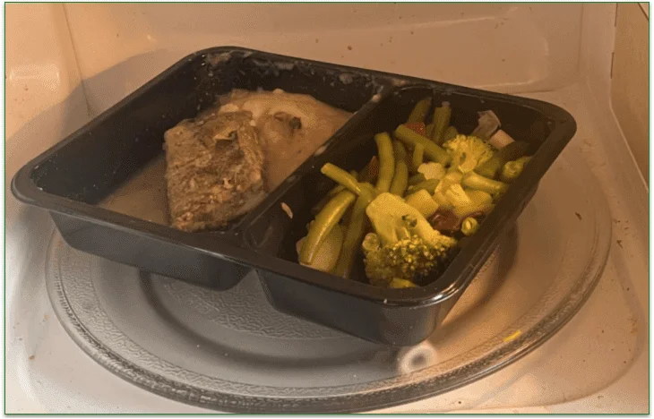 Freahology's Asian Steak dish being heated in the microwave