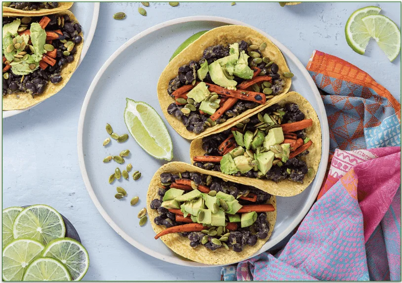 Maple-Chipotle Carrot Tacos with Mojo Verde Black Beans & Spicy Pepitas by Purple Carrot