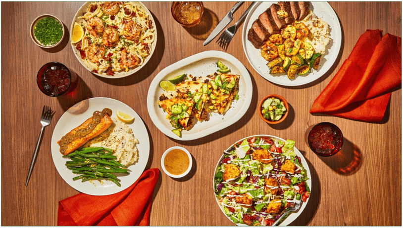 spread of several everyplate meals on a table