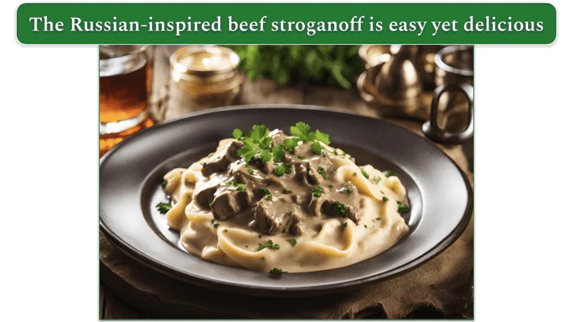 a plate of beef stroganoff served with herbs over a bed of fluffy mashed potatoes