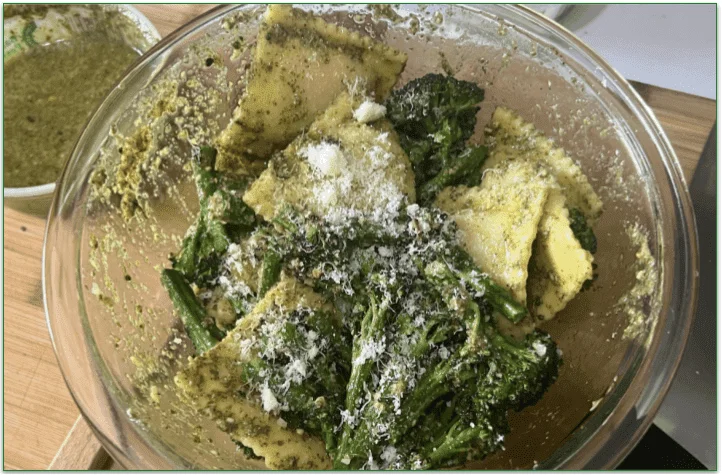 Hungryroot's Green Machine Pesto Ravioli served in a bowl with a sprinkle of Parmesan