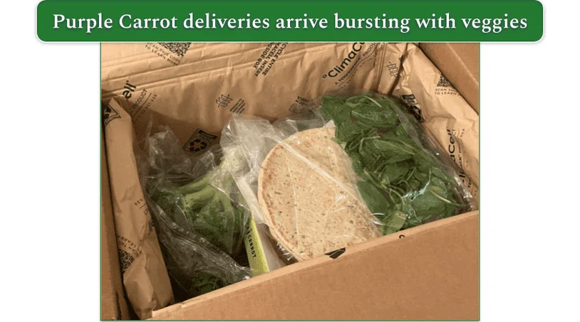 Open Purple Carrot box with ingredients