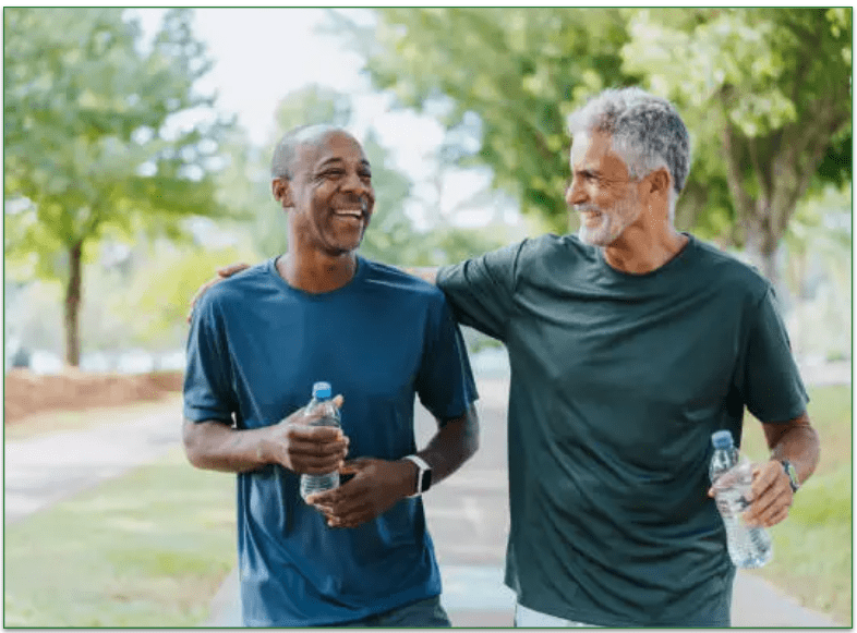 image of 2 men out walking holding water bottles