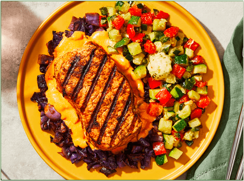 Factor's Chipotle-Rubbed Pork Chop with Roasted Cabbage & Red Bell Pepper Fondue