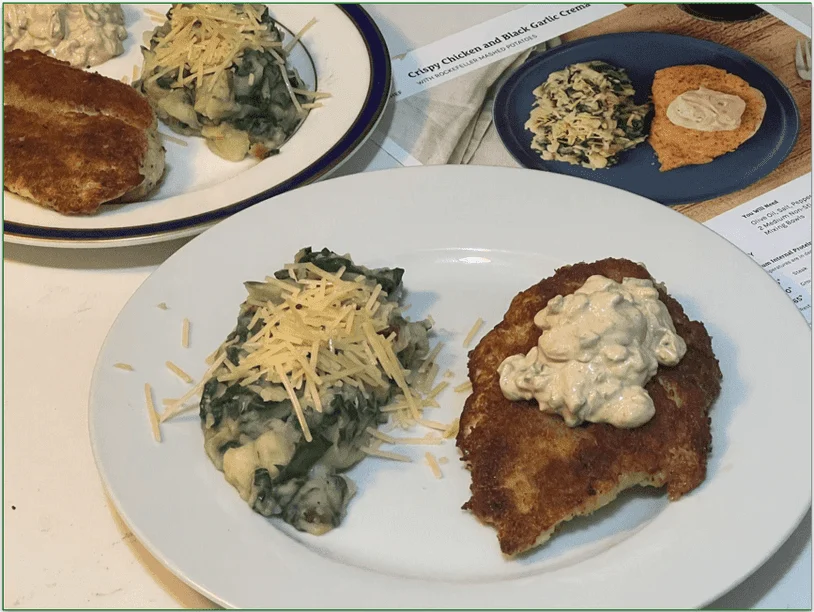 Two plates of Home Chef's Crispy Chicken and Black Garlic Crema