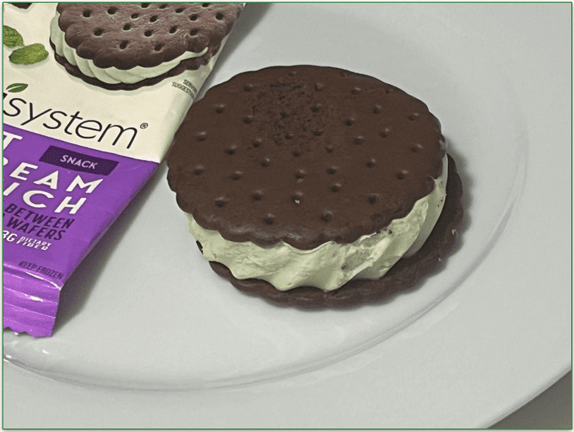 A Nutrisystem ice cream sandwich on a plate