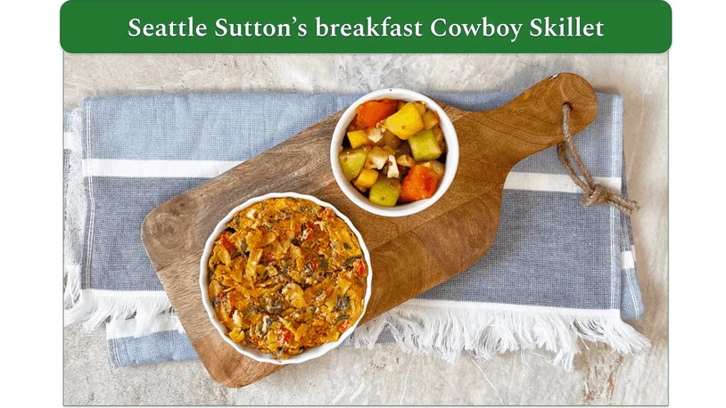 Image of Seattle Sutton's Cowboy Skillet displayed next to a bowl of chopped fruit