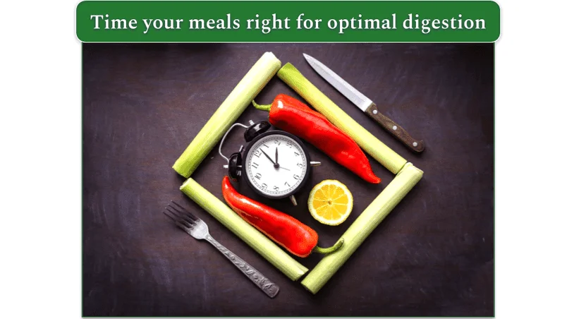 Clock surrounded by vegetables with a knife and fork