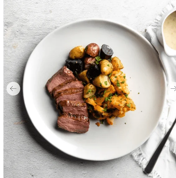 Photo of Home Bistro’s Lemon-Caper Piccata Steak on a white plate