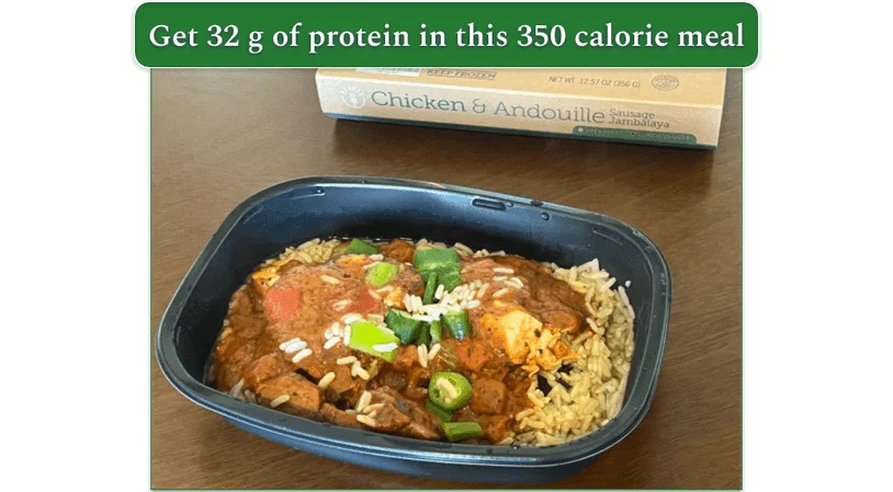 Chicken and Andouille sausage jambalaya in a microwave safe dish with the box behind it