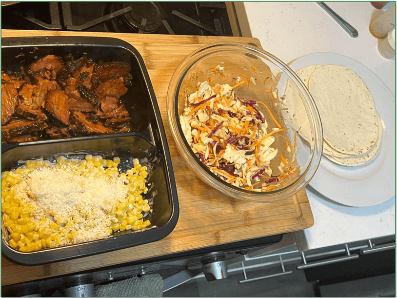 Various taco components from Home Chef set up in an assembly line