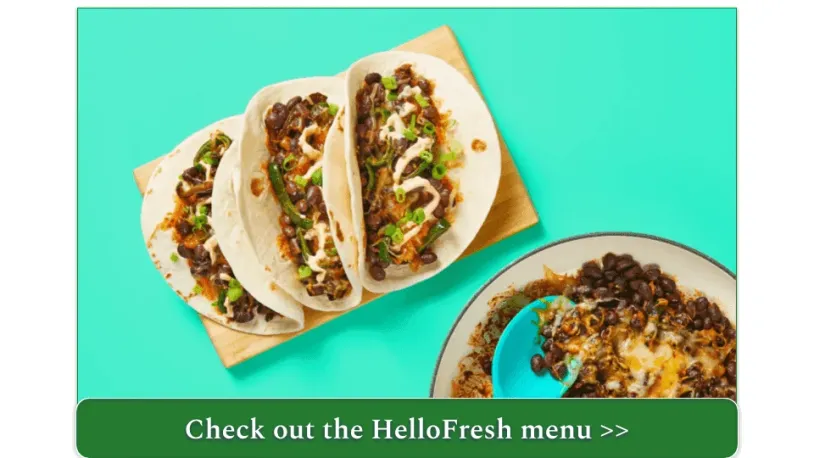 A pan of cheesy beans and three tacos on a cutting board