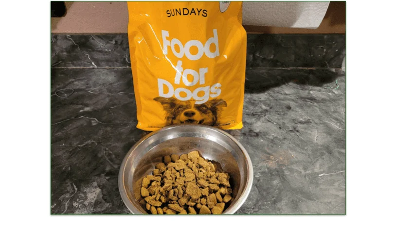 Bowl of dog food in front of a Sundays food bag