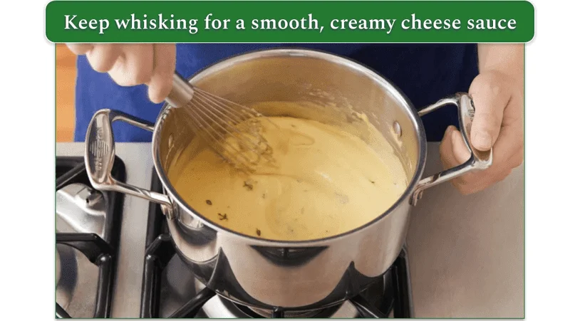 Cheese sauce being whisked in a pot on the stove from Blue Apron