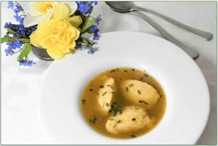 A plate of Dumplings and Chicken Soup