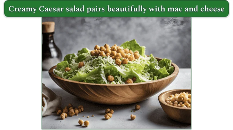 a wooden bowl filled with caesar salad and roasted chickpeas