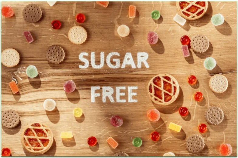 The text "sugar free" surrounded by candy and other sweet foods