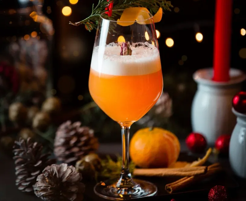 Celebration mocktail surrounded by Christmas decorations