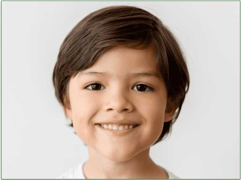 a boy smiling with healthy teeth showing