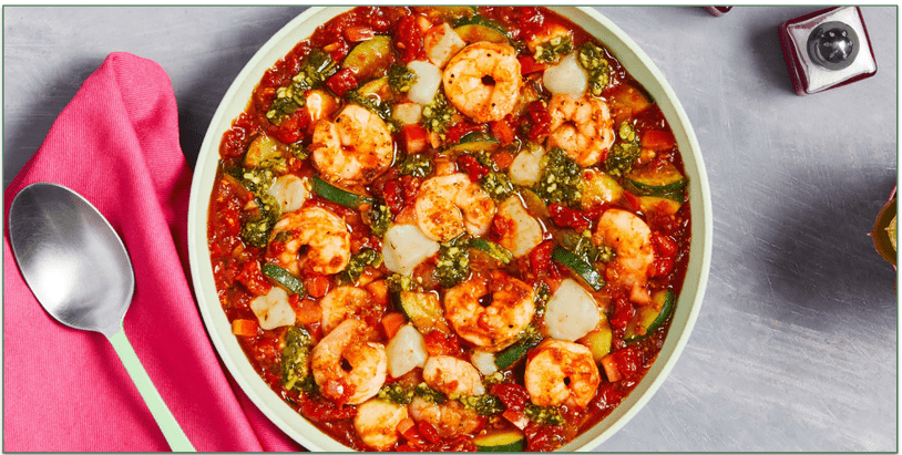 A bowl of shrimp in a tomato sauce