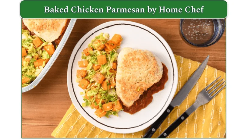A plate of baked chicken Parmesan with butternut squash and Brussels sprouts