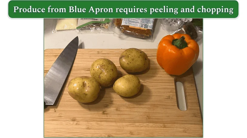 Whole produce from Blue Apron on a wooden chopping board