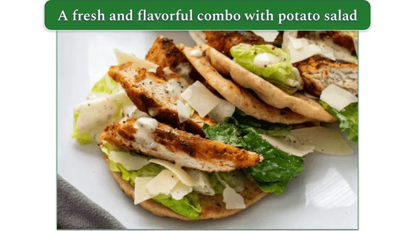 A grilled chicken and salad pita served on a plate