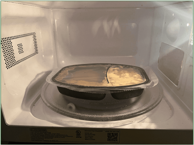 A frozen Nutrisystem meal being heated in the microwave