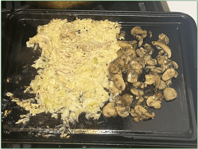 Dijon chicken thighs, as prepared by our reviewer, being heated in the oven