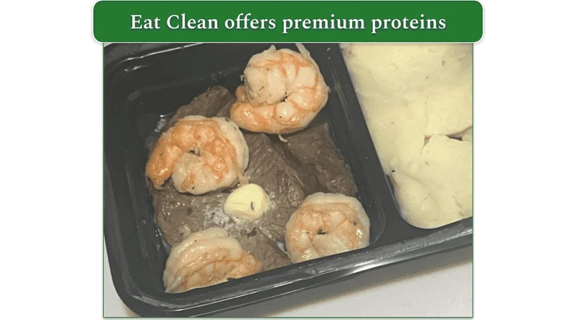 Close-up on cooked steak and shrimp from an Eat Clean meal