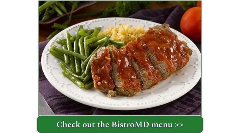 A plate of meatloaf with green beans