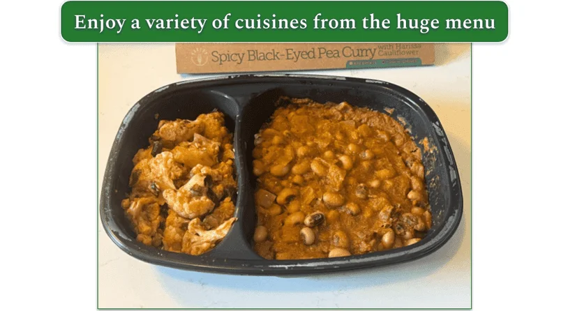 An image of Spicy black-eyed pea curry heated in the microwaveable container