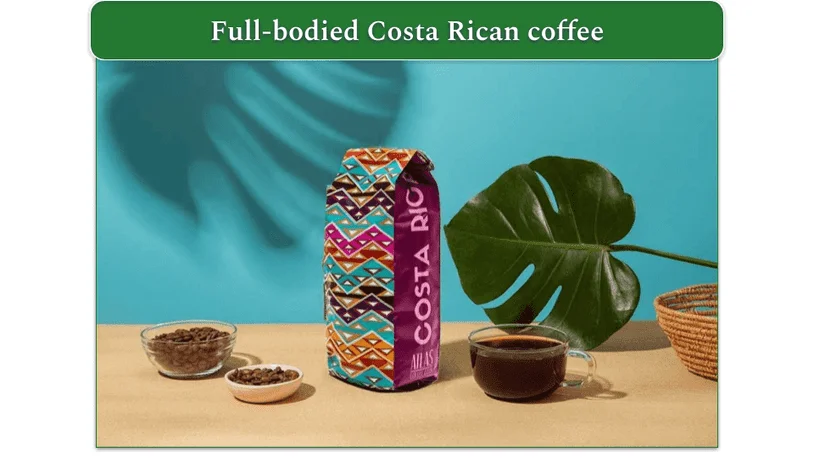 Image of Atlas Coffee Club's Costa Rican coffee with whole beans, a bag of coffee, and a cup of coffee displayed