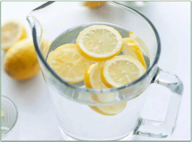 Sliced lemons in a jug of water