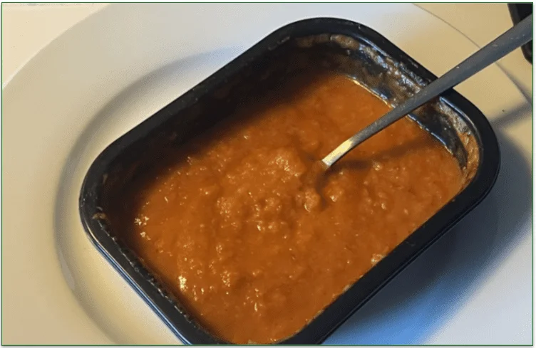 Photo of the Café-Style Soup Creamy Tomato from Nutrisystem served in the microwaveable tray on a plate