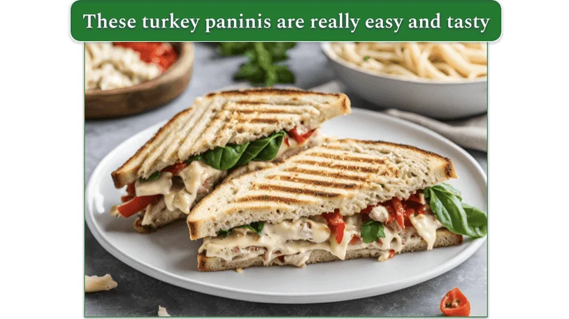 a plate of turkey paninis alongside some pasta salad