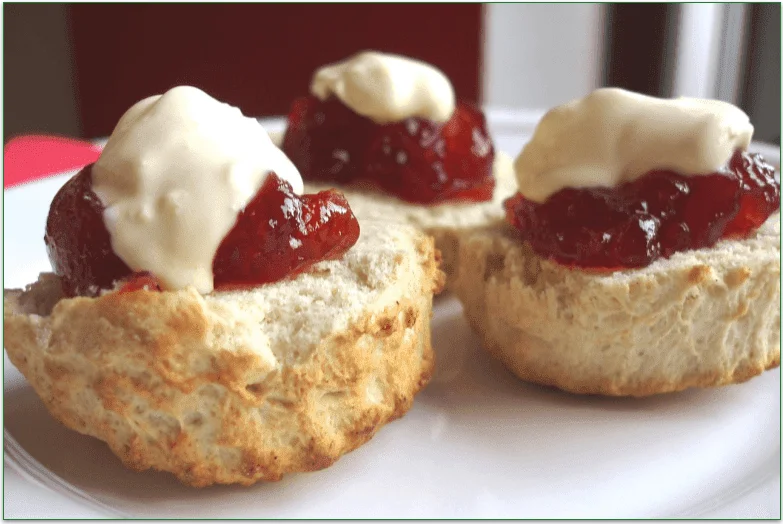 Biscuits topped with jam and cream