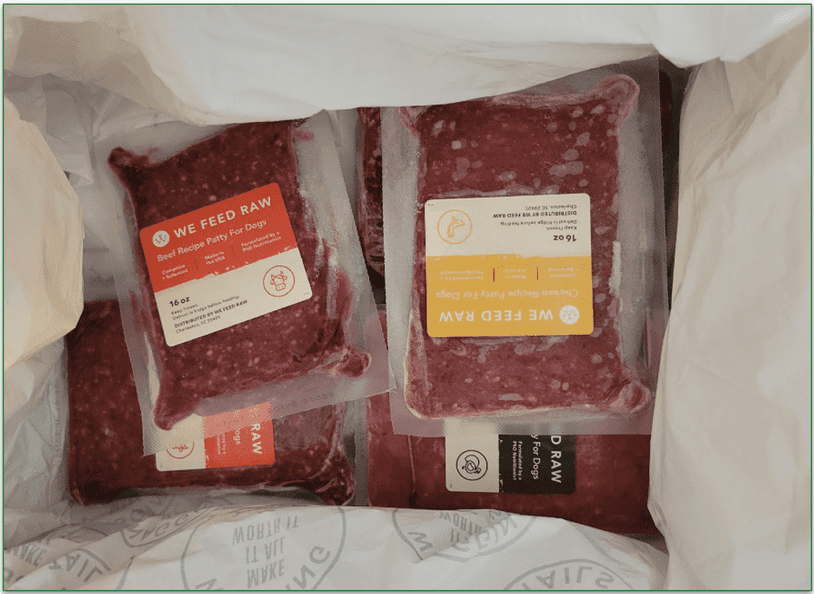 Open We Feed Raw delivery box with frozen packs