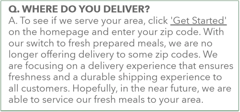 A woman and child collecting a Veestro delivery box from the porch